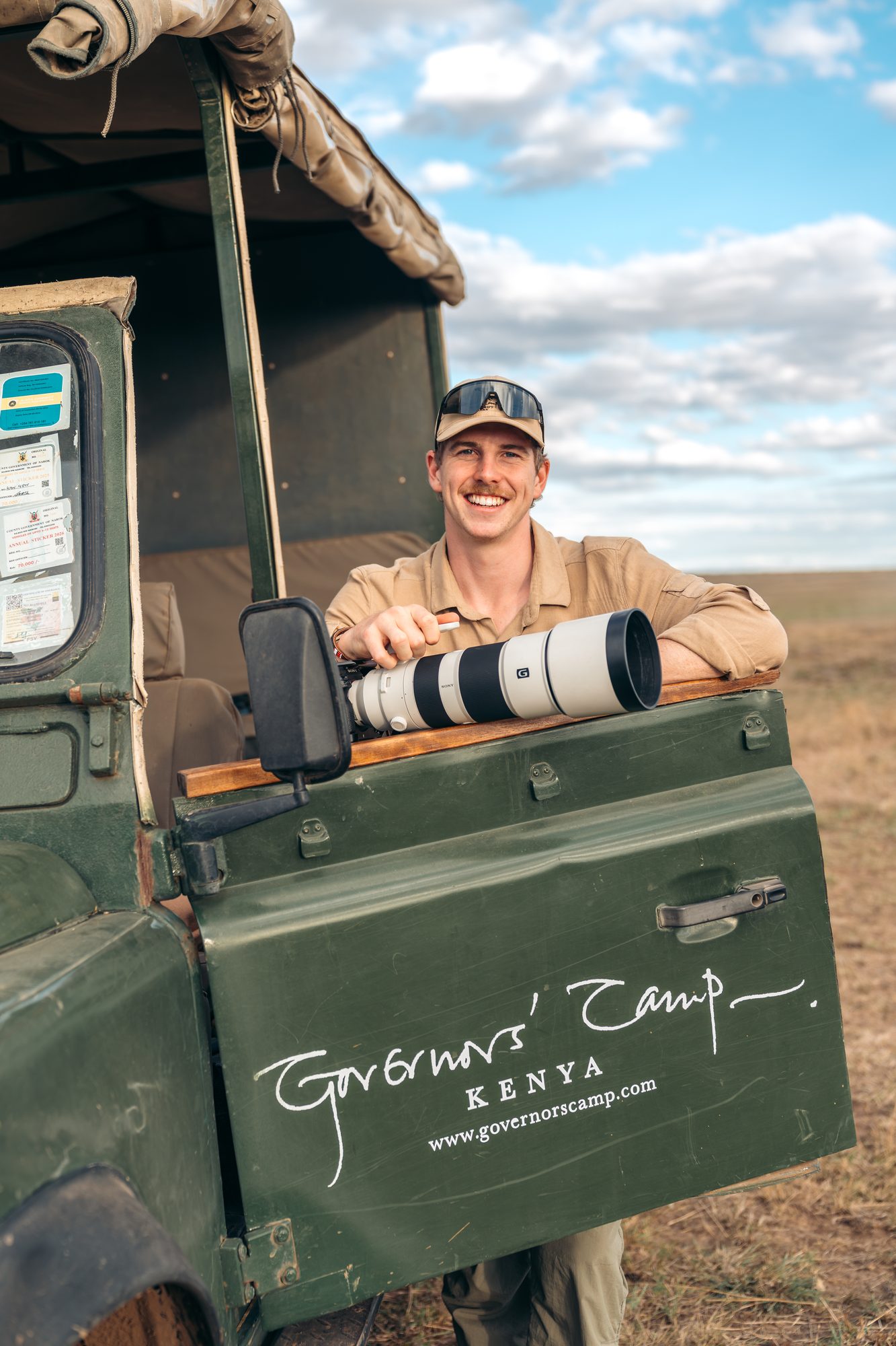 Charlie with a camera in a Governors&rsquo; Camp vehicle, Maasai Mara